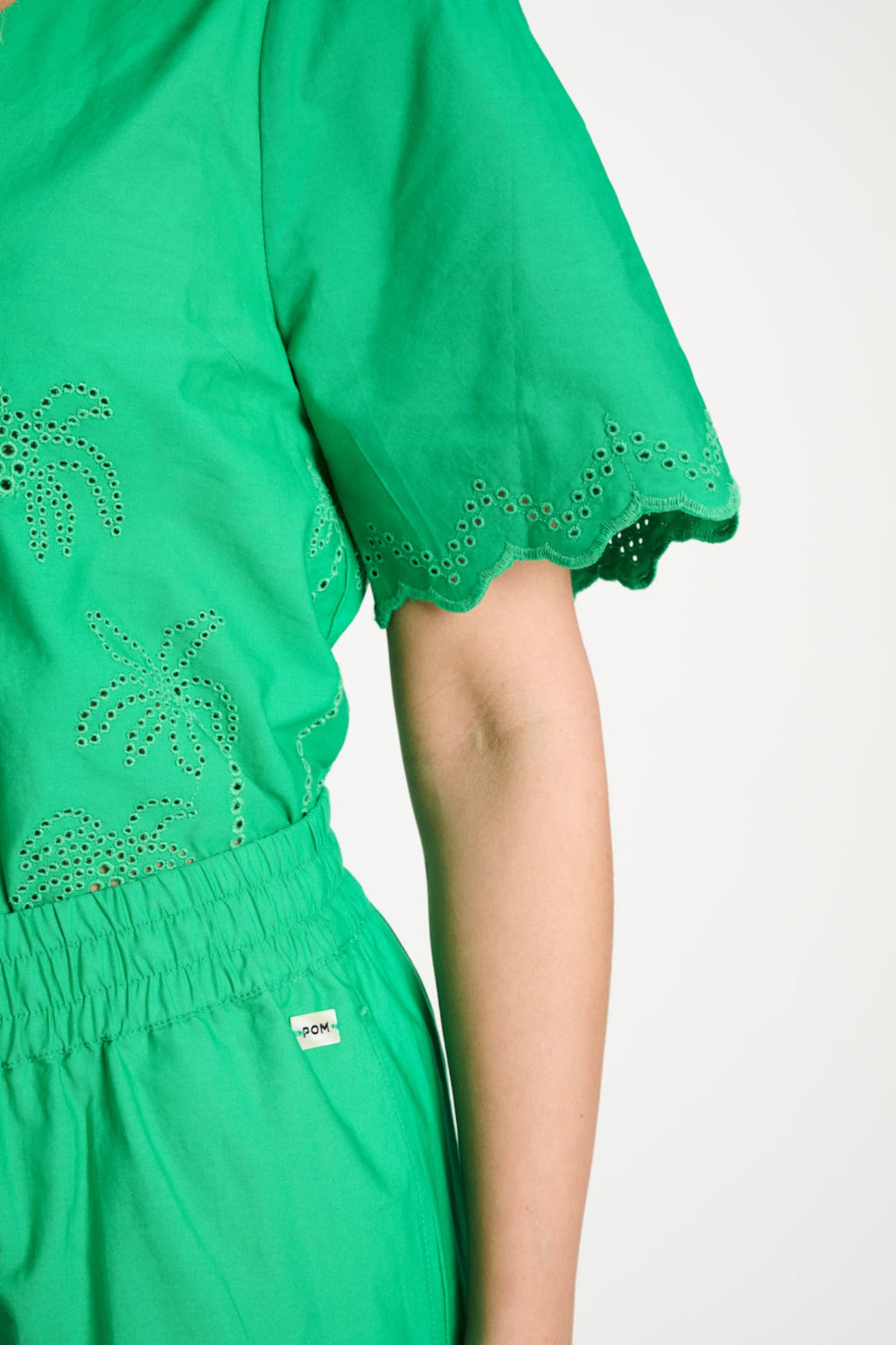 Close-up of Pom Amsterdam SP9544 Broderie Anglaise Palm Green Organic Cotton Blouse by Pom Amsterdam, shop Pom Amsterdam at Dotique