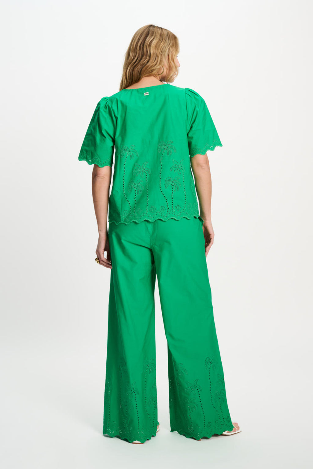 Back view of woman in Pom Amsterdam SP9544 Broderie Anglaise Palm Green Organic Cotton Blouse by Pom Amsterdam shop Dotique