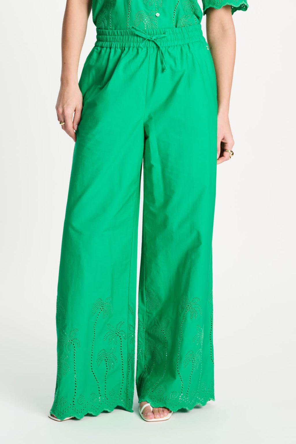 Front view of Pom Amsterdam SP9565 Broderie Anglaise Palm Green Organic Cotton Trousers, shop Pom Amsterdam at Dotique