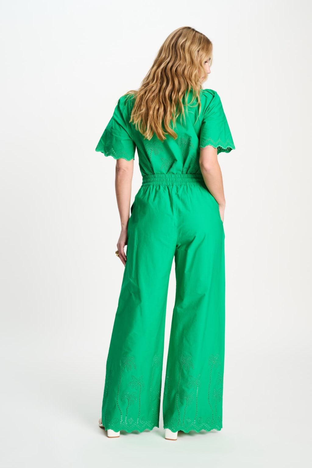 Back view of model in Pom Amsterdam SP9565 Broderie Anglaise Palm Green Organic Cotton Trousers, shop Pom Amsterdam at Dotique