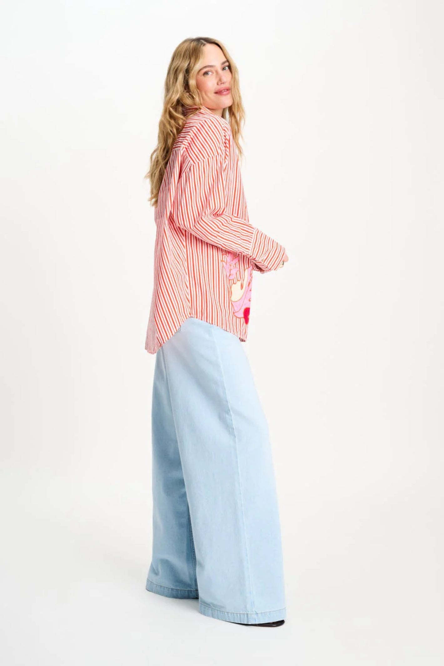 Side view of woman wearing Pom Amsterdam SP9503 Blouse Poplin Striped Orange by Pom Amsterdam, shop Pom Amsterdam at Dotique