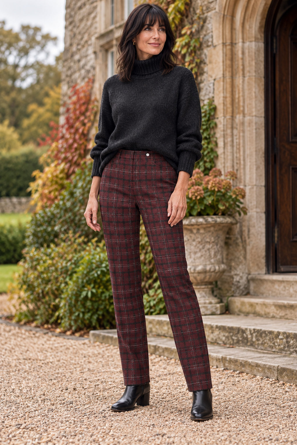 Robell Bella red check trousers styled with a charcoal knit and black ankle boots. Shop Robell at Dotique.
