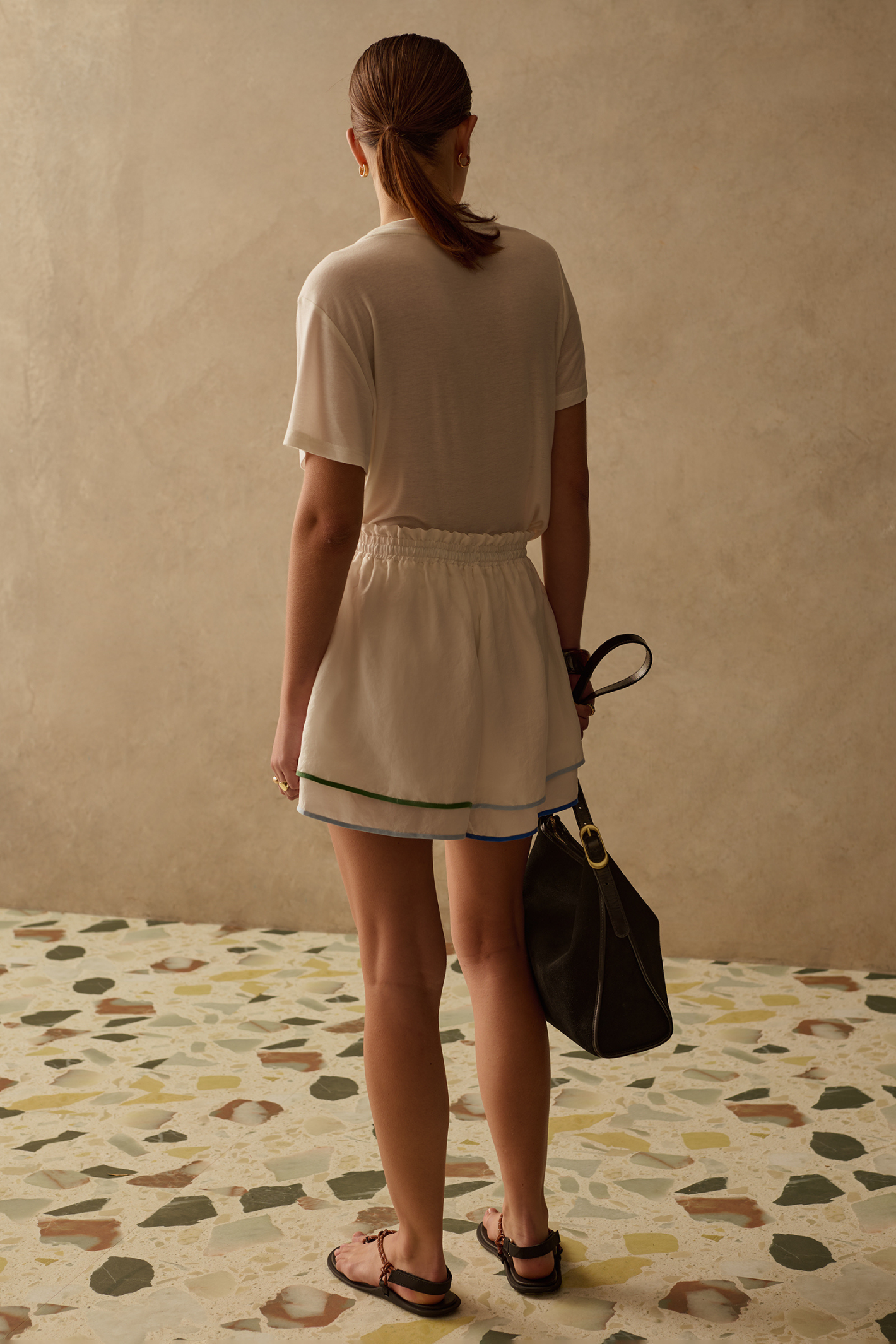 Lightweight cupro shorts by Sancia with elasticated waist, drawstring detail and floaty layered hem. Easy summer styling at Dotique.