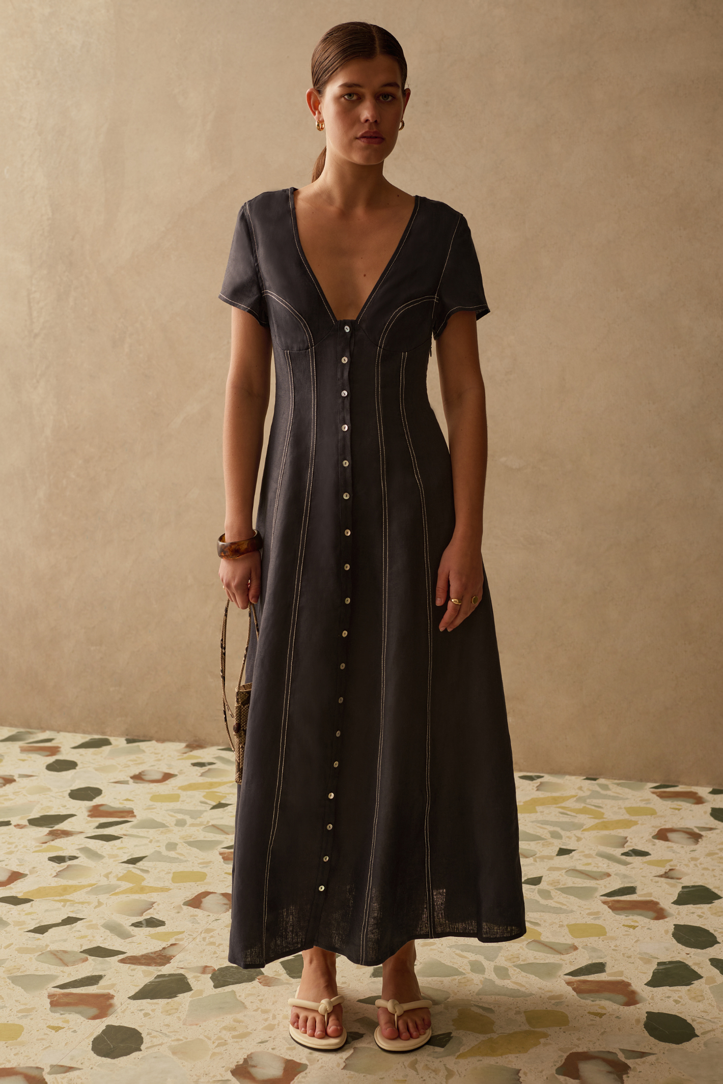 Sancia Greta Dress in navy with flattering V neckline, button front and flowing skirt. Lightweight cupro fabric. Shop now at Dotique.