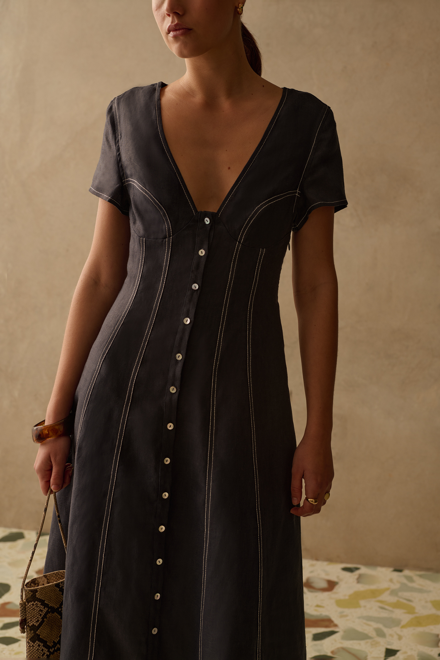 Sancia Greta Dress in navy with flattering V neckline, button front and flowing skirt. Lightweight cupro fabric. Shop now at Dotique.