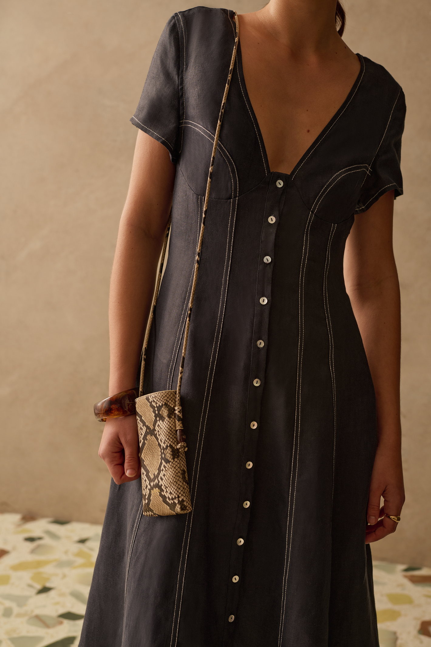 Sancia Greta Dress in navy with flattering V neckline, button front and flowing skirt. Lightweight cupro fabric. Shop now at Dotique.