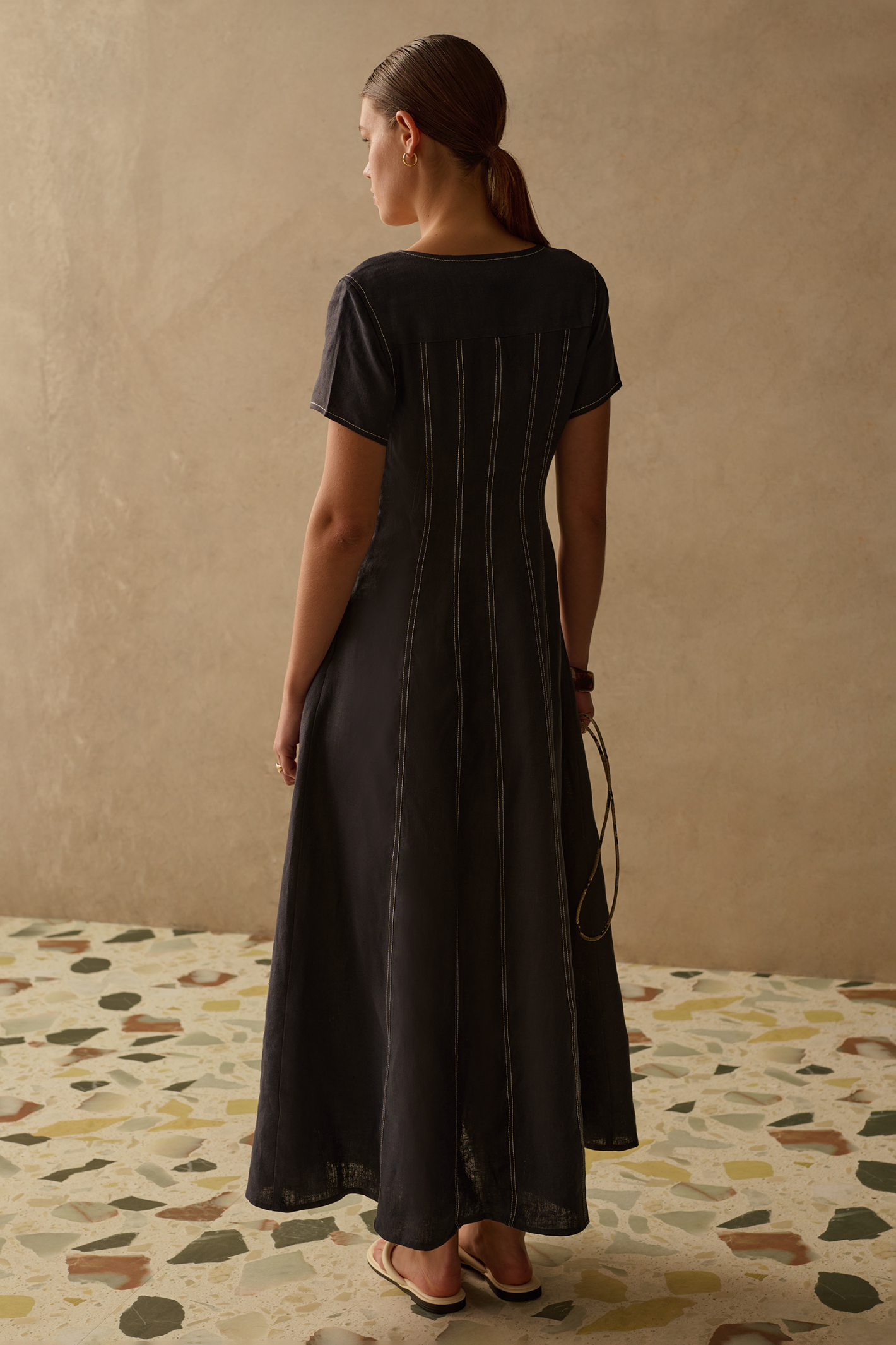 Sancia Greta Dress in navy with flattering V neckline, button front and flowing skirt. Lightweight cupro fabric. Shop now at Dotique.