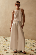 Wide leg cupro trousers by Sancia with elasticated waist and drawstring detail. Lightweight, fluid and easy to style. Shop at Dotique.