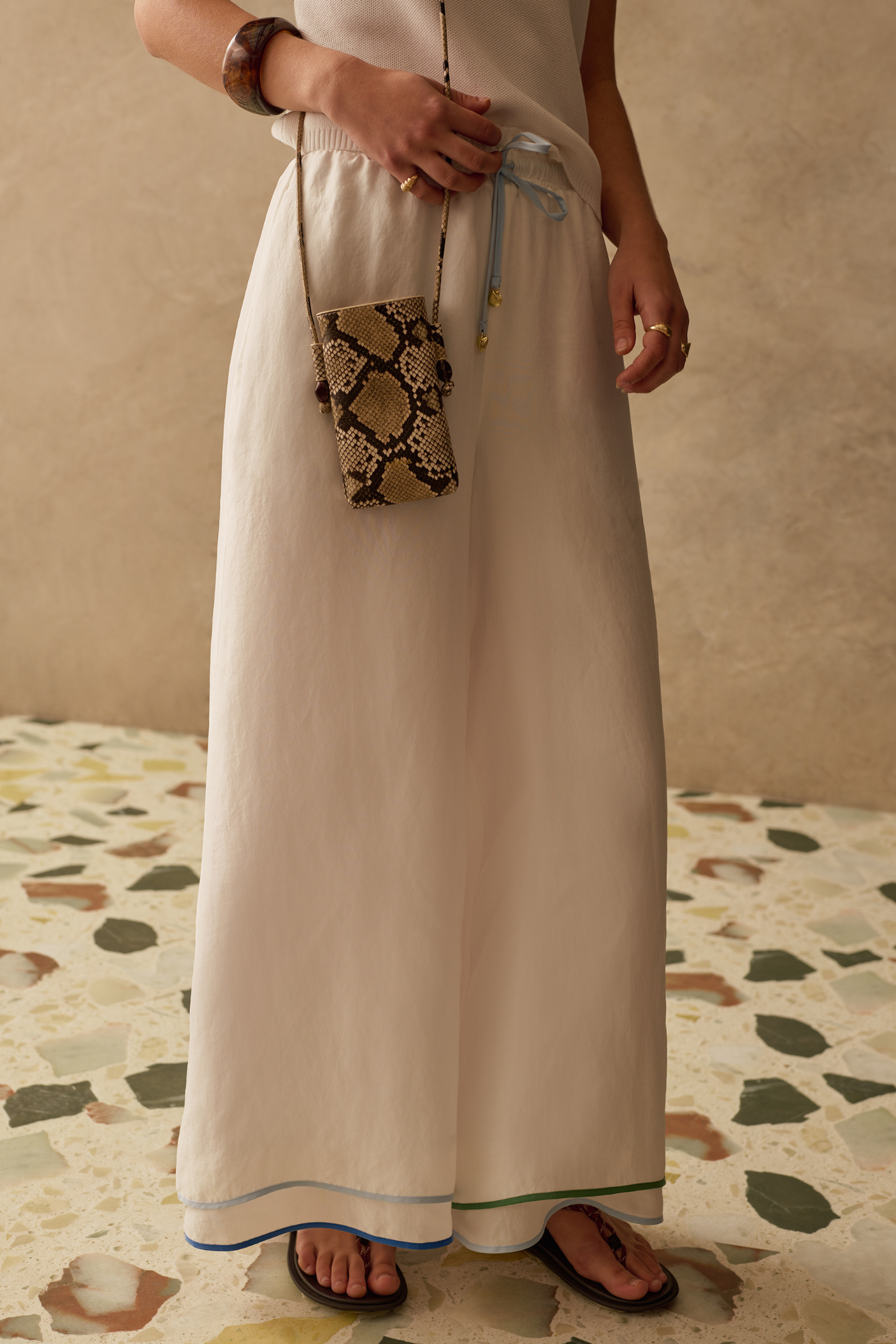 Wide leg cupro trousers by Sancia with elasticated waist and drawstring detail. Lightweight, fluid and easy to style. Shop at Dotique.
