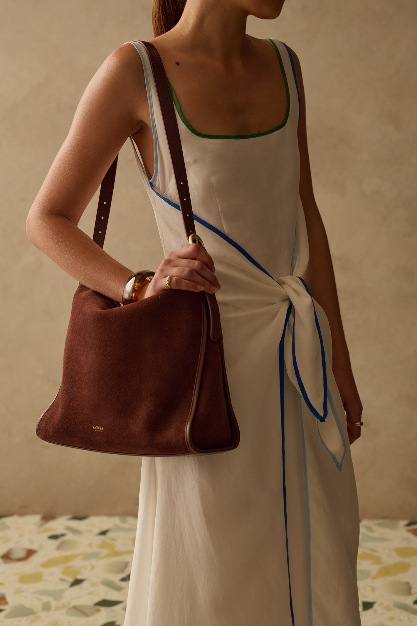 Relaxed yet flattering maxi dress by Sancia with a square neckline and adjustable tie front. Lightweight, easy to wear and perfect for summer. Shop at Dotique.