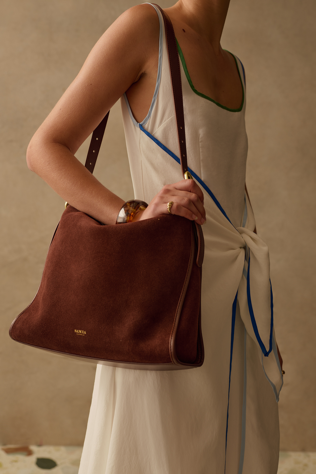 Relaxed yet flattering maxi dress by Sancia with a square neckline and adjustable tie front. Lightweight, easy to wear and perfect for summer. Shop at Dotique.