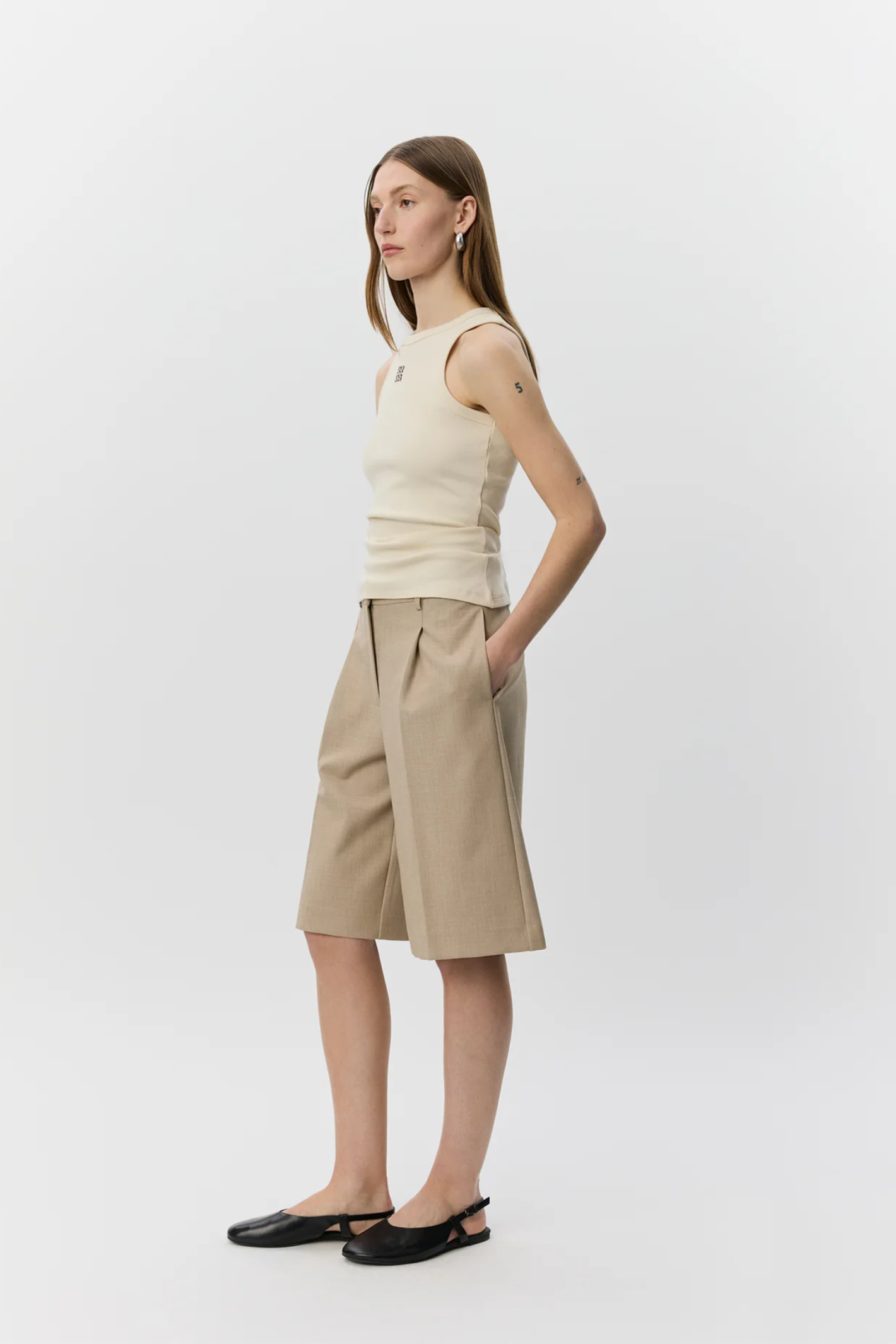 Model wearing Sofie Schnoor Becasw Rib Tank Top Cream White S262362 by Sofie Schnoor shop Dotique