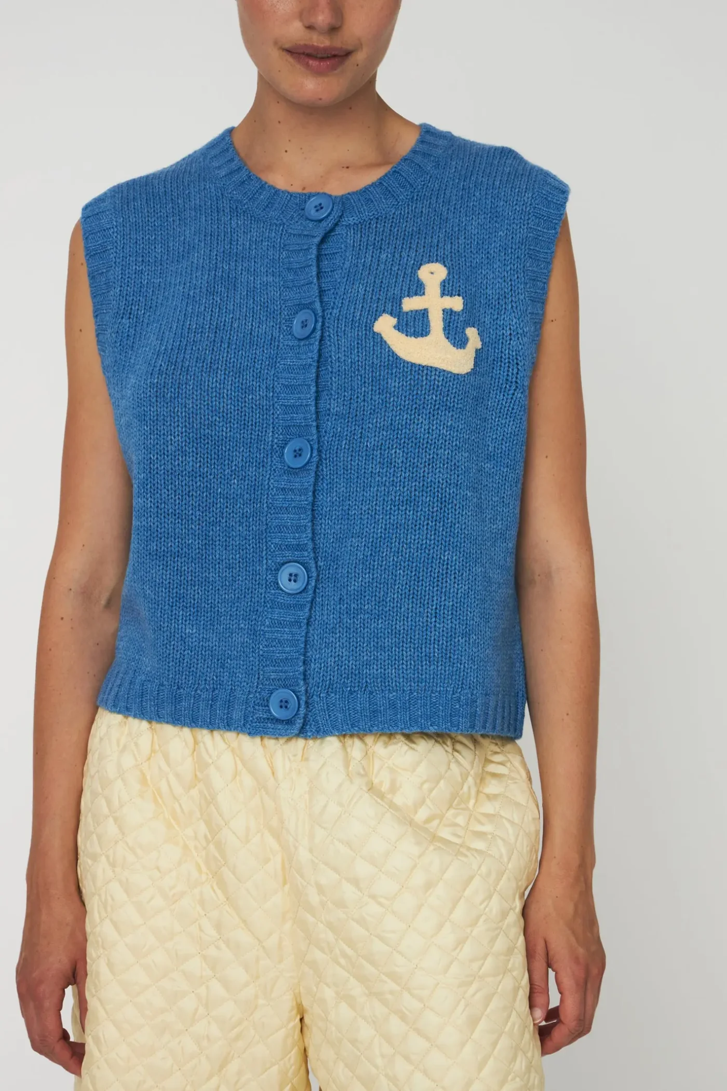 Front view of Stella Nova Anchor Vest Blue Sea by stella nova, shop stella nova at Dotique in a cozy knit design