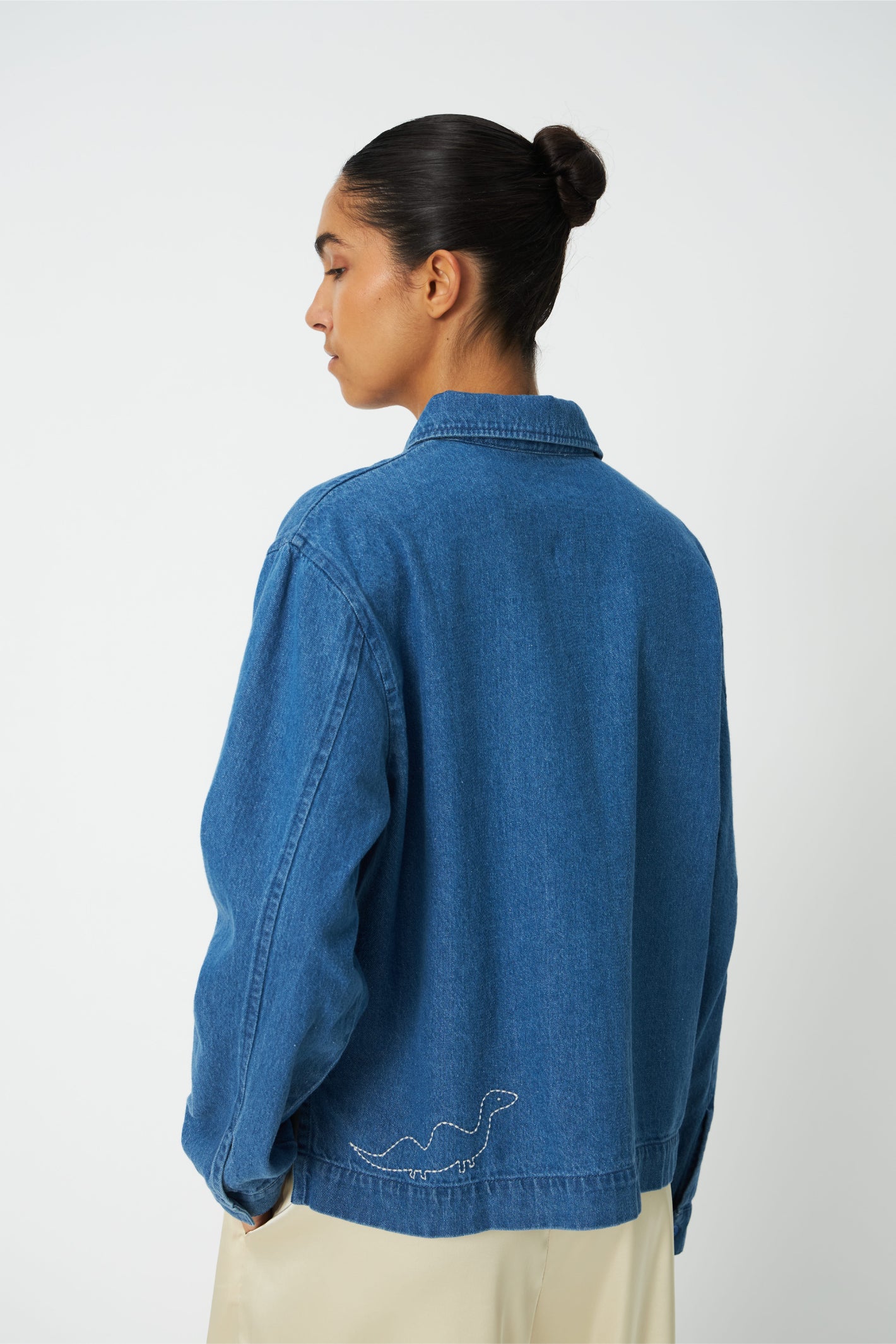 The Stella Nova Denim Shirt with Artwork takes a classic wardrobe staple and gives it a playful twist. Shop Stella Nova at Dotique.