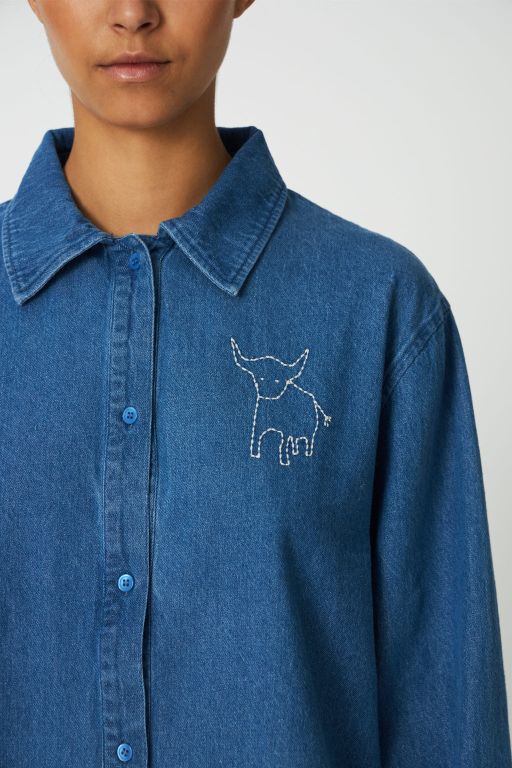 The Stella Nova Denim Shirt with Artwork takes a classic wardrobe staple and gives it a playful twist. Shop Stella Nova at Dotique.