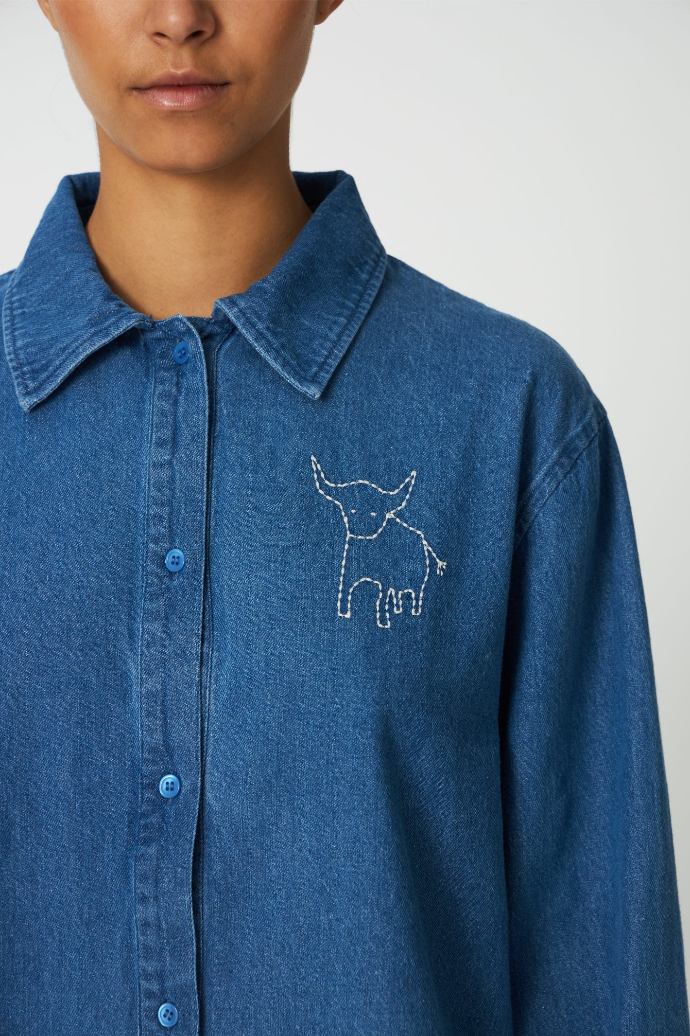 The Stella Nova Denim Shirt with Artwork takes a classic wardrobe staple and gives it a playful twist. Shop Stella Nova at Dotique.