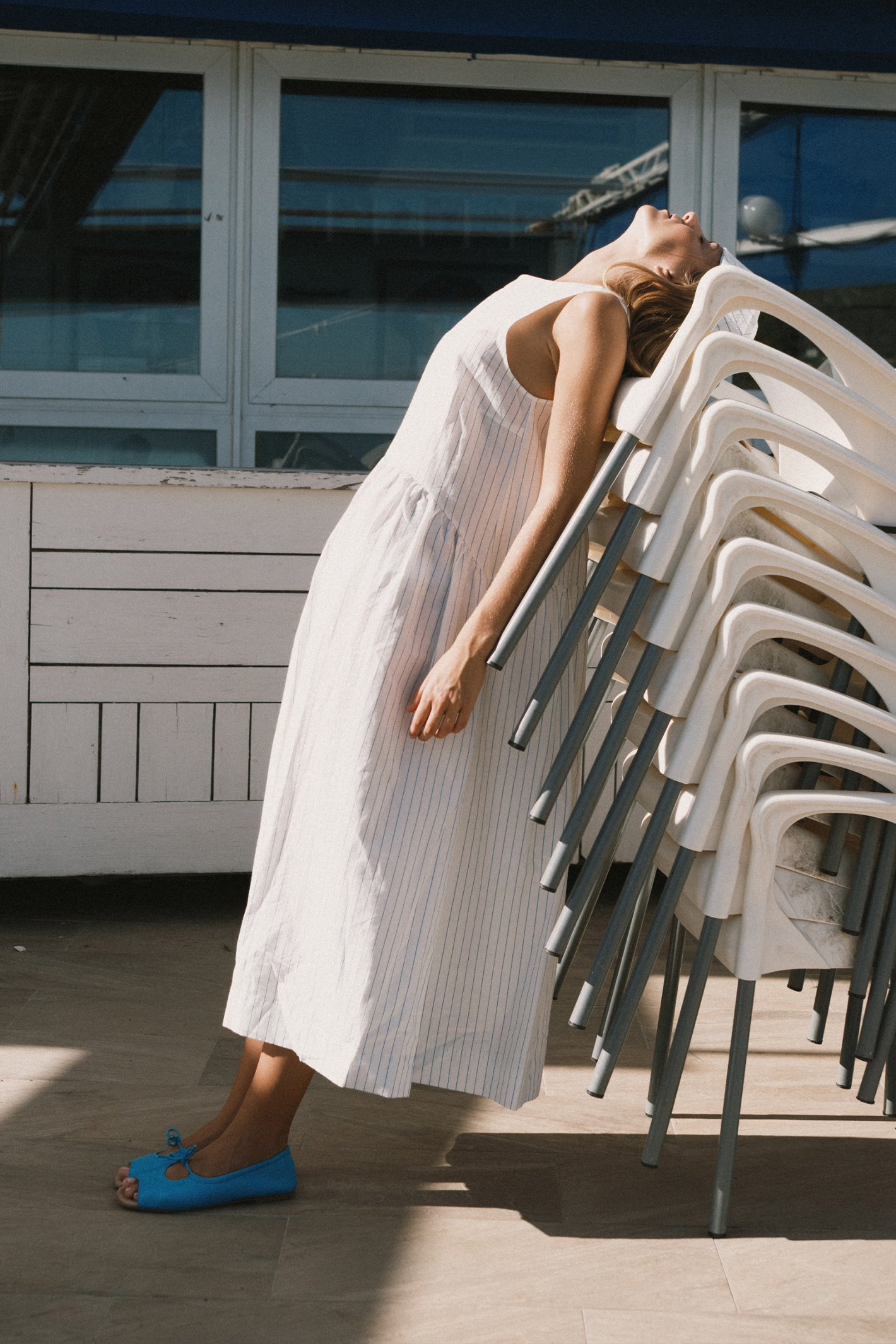 Tiny Big Sister striped cotton dress with a low back detail and relaxed summer fit. Light, flattering and easy to wear. Shop at Dotique.