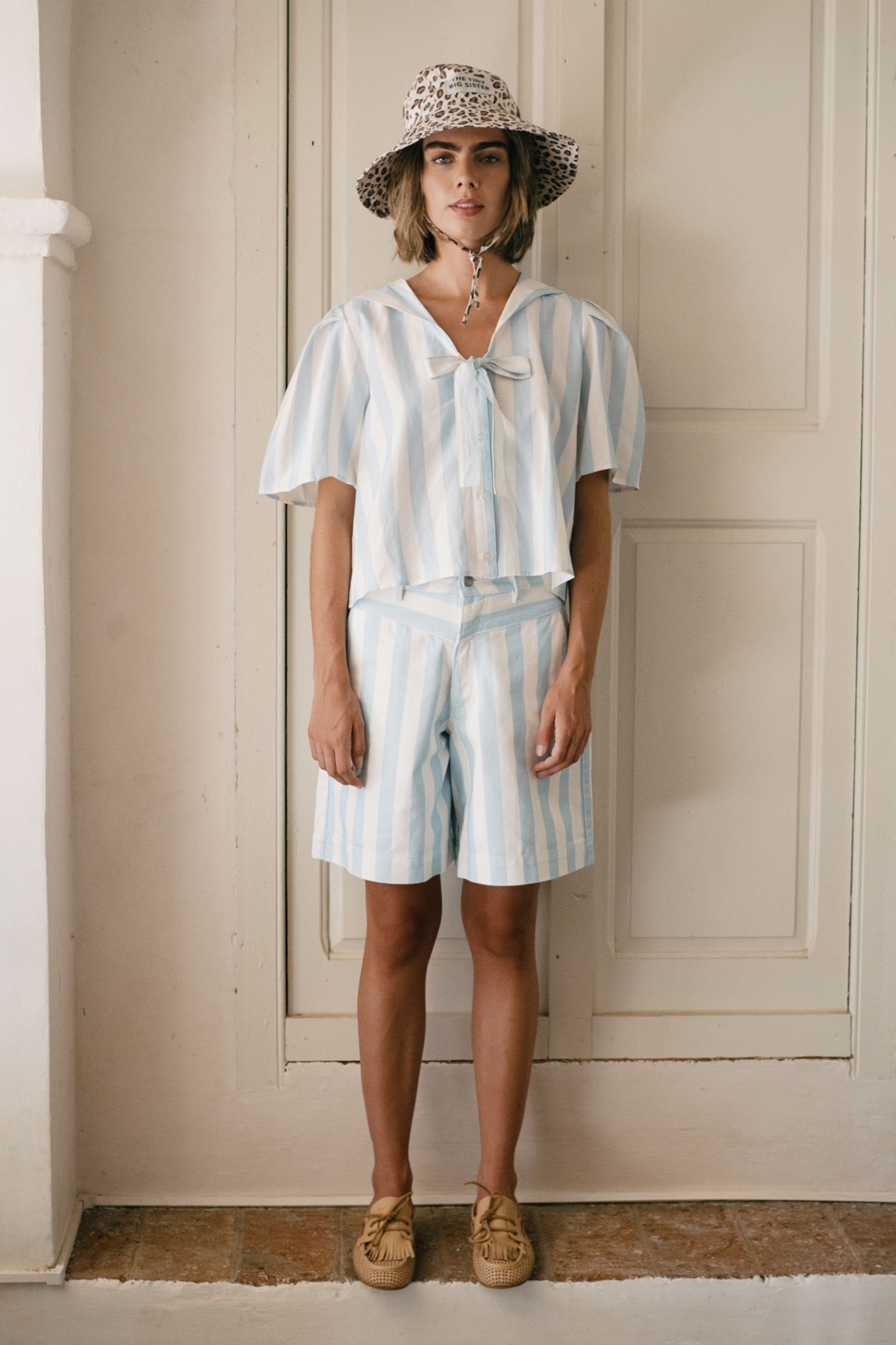 Tiny Big Sister striped Bermuda shorts in soft cotton with a flattering, relaxed fit. Perfect for summer styling. Shop at Dotique.