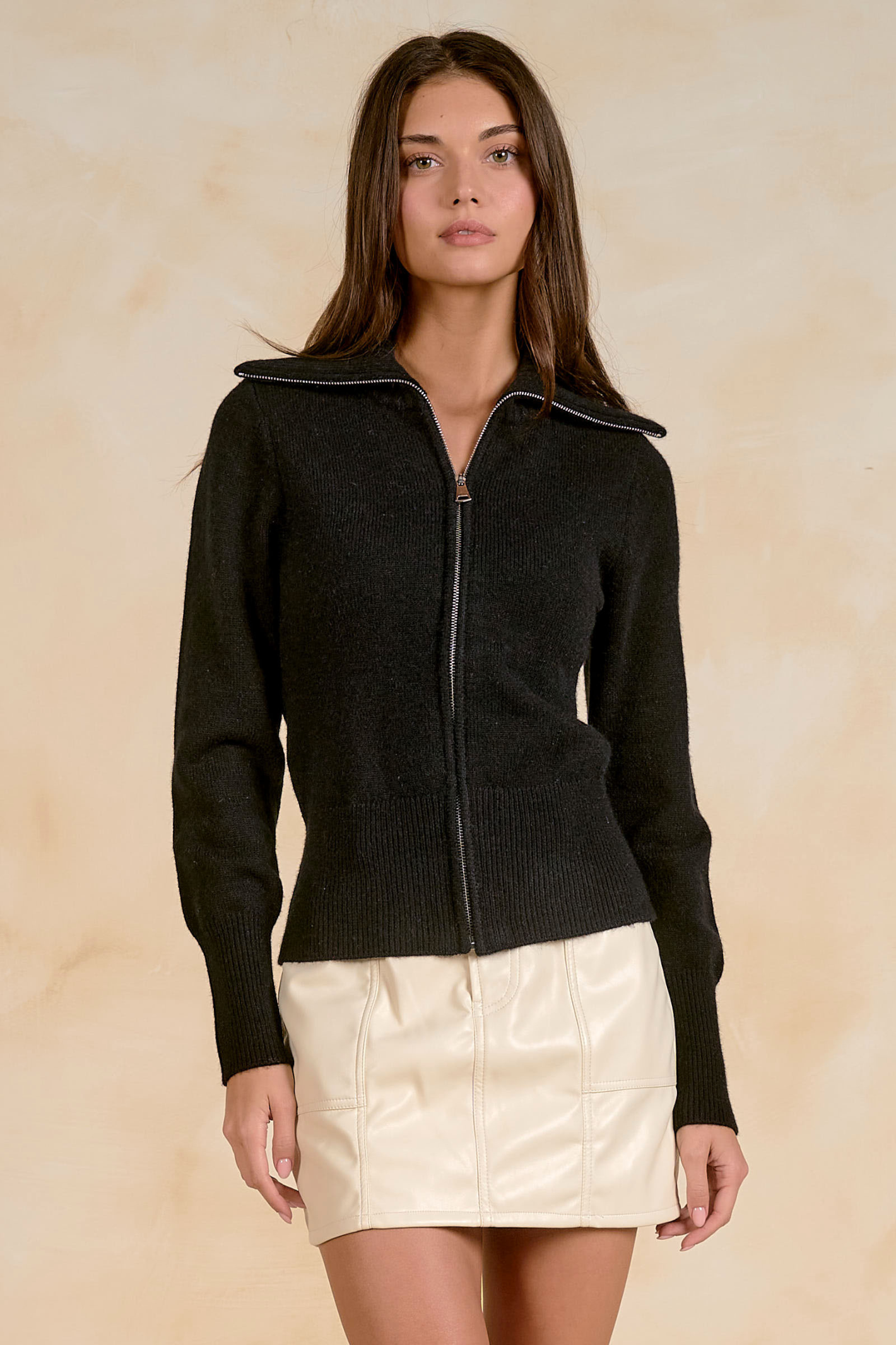 Model wearing the Elan SW11688 Sweater 1/4 Zip Open Knit Black by Elan, featuring a textured knit and zip front, shop Elan at Dotique.