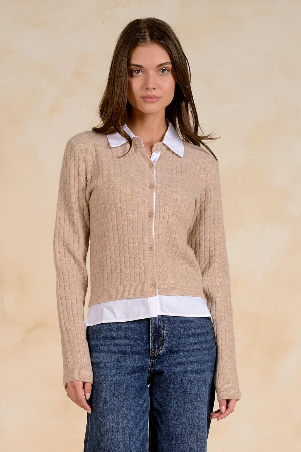 Model wearing the Elan SWB11714 Collared Cardigan Tan/White by Elan, featuring a cozy knit and button front, shop Elan at Dotique.