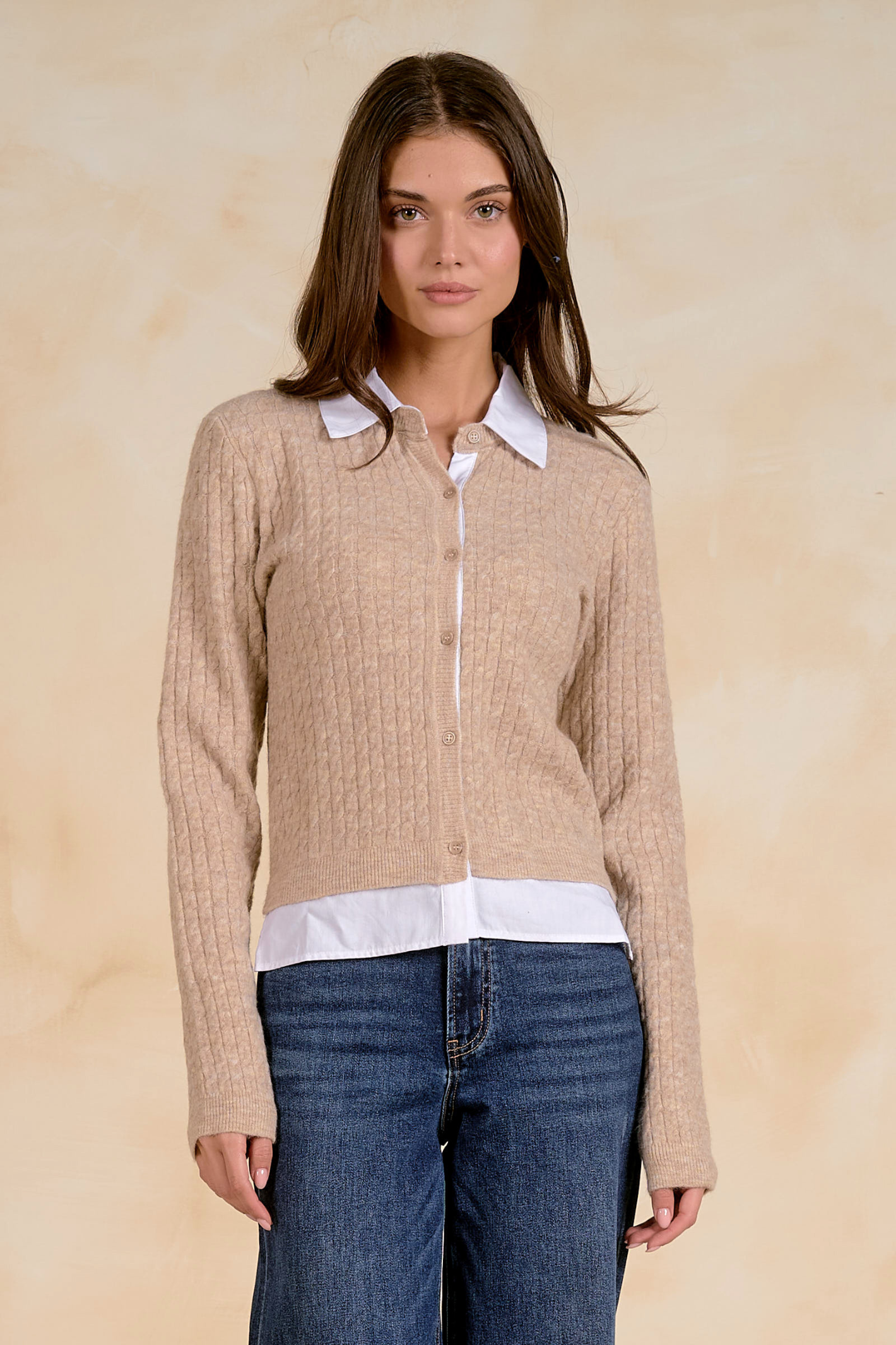Model wearing the Elan SWB11714 Collared Cardigan Tan/White by Elan, featuring a cozy knit and button front, shop Elan at Dotique.