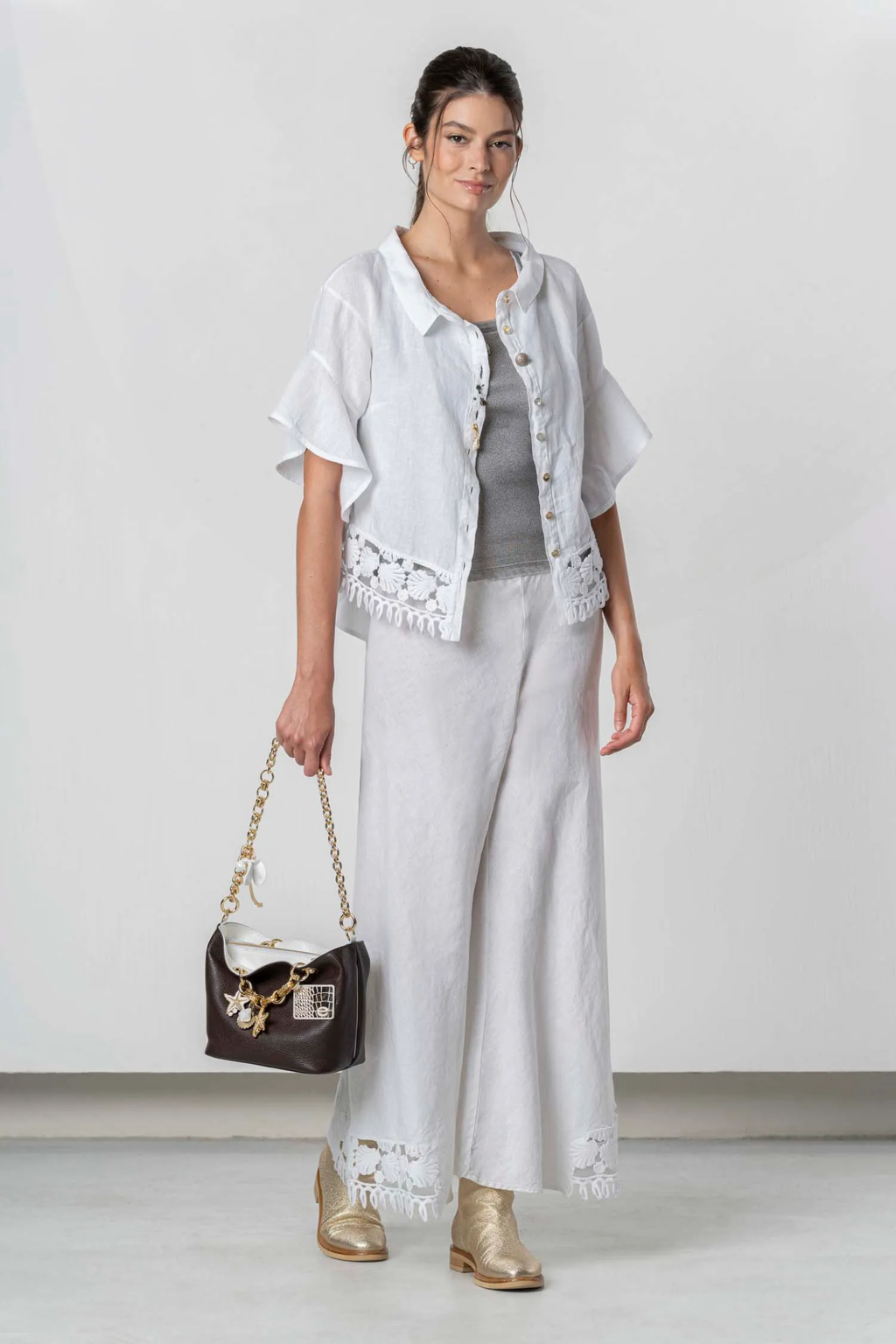 Model wearing Elisa Cavaletti Linen Lace Shirt White EAP261098205 featuring lace trim and button-front by Elisa Cavaletti, shop Elisa Cavaletti at Dotique.