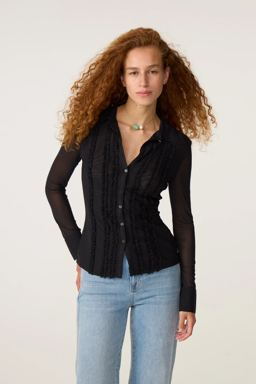 Fabienne Chapot Black Kiki Blouse by Fabienne Chapot model wearing black blouse Shop Fabienne Chapot at Dotique