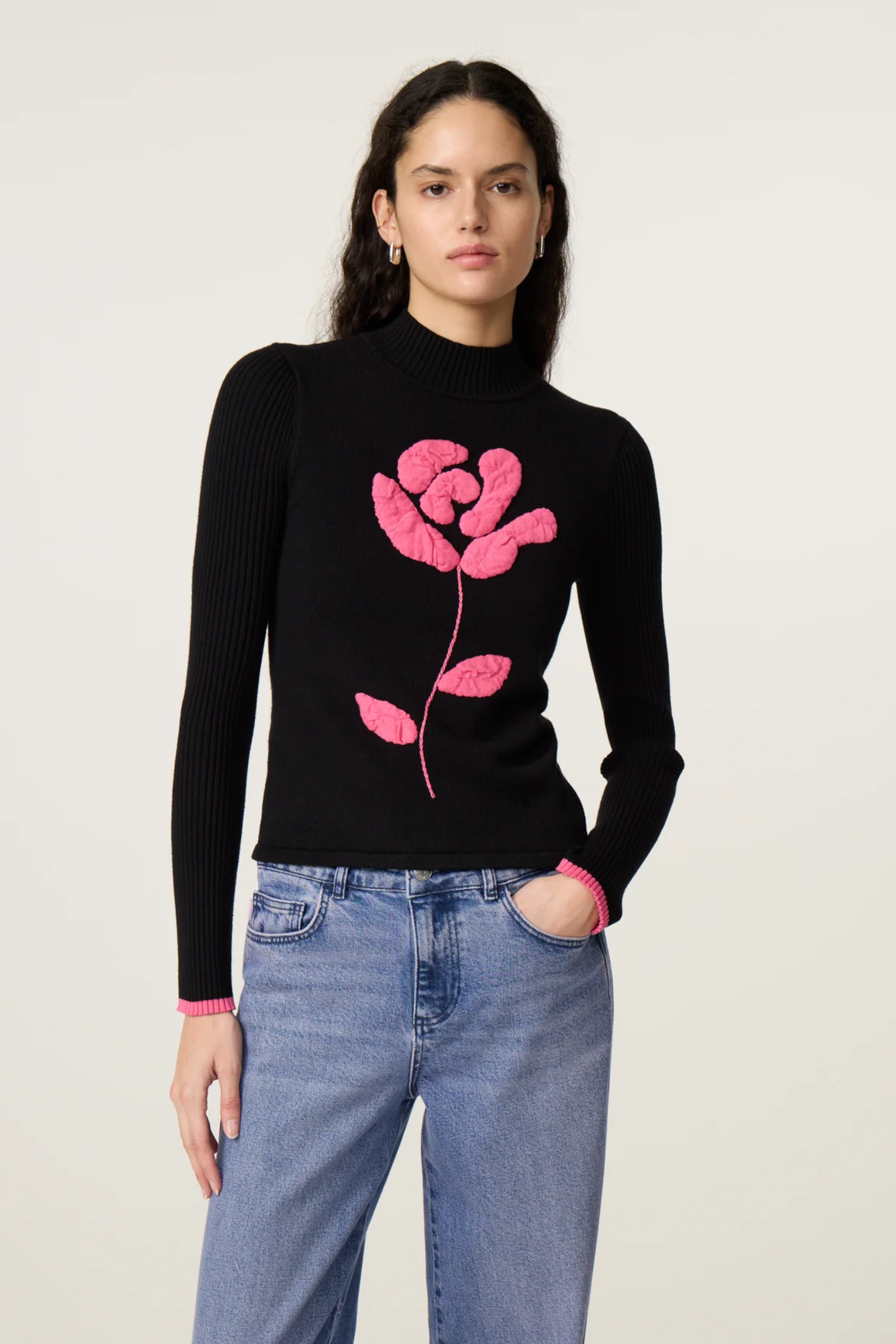 Model wearing Fabienne Chapot Courtney Rose Pullover Black, featuring pink rose design; shop Fabienne Chapot at Dotique.