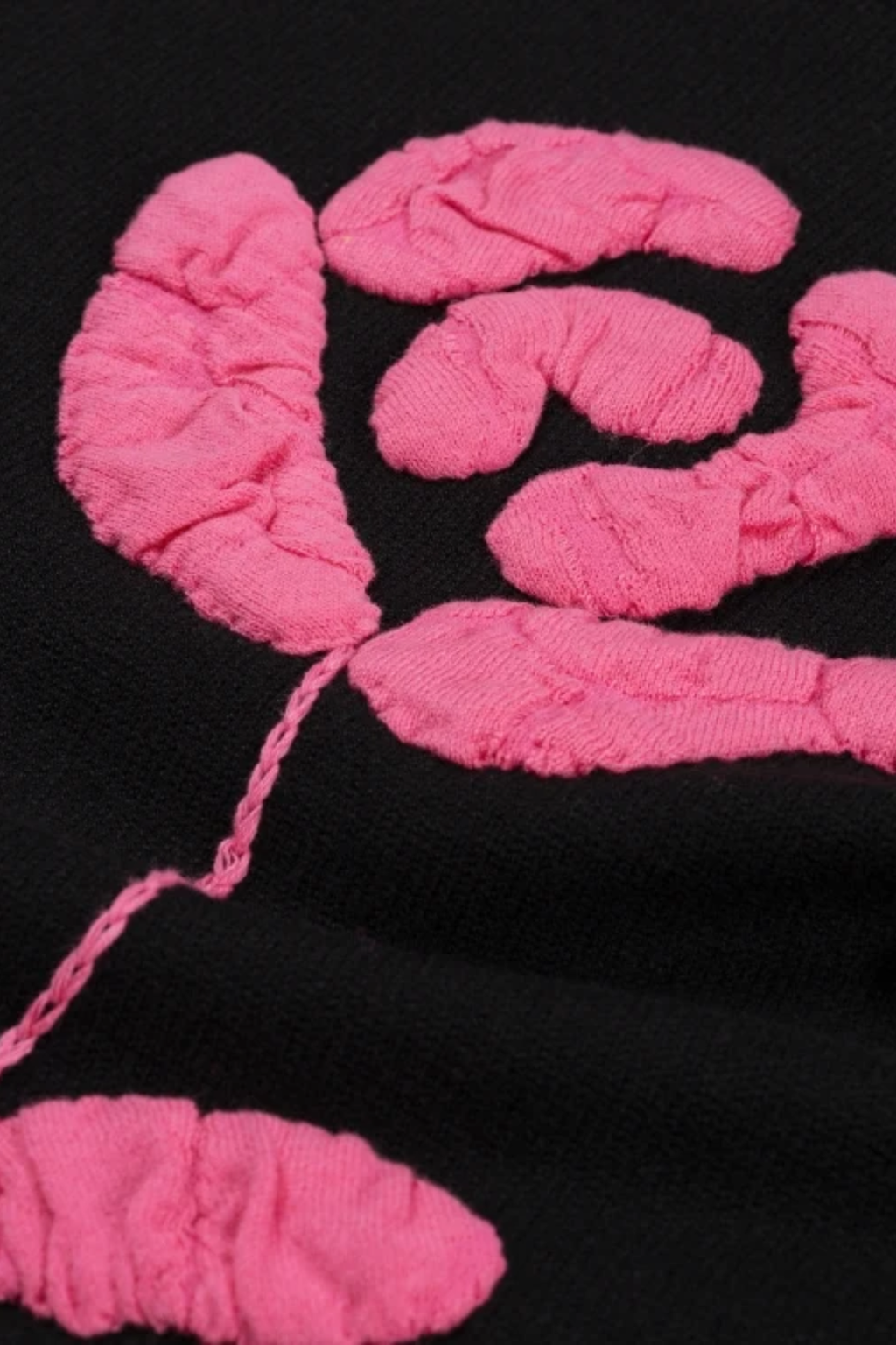 Close-up of pink textured embroidery on Fabienne Chapot Courtney Rose Pullover Black by Fabienne Chapot, shop at Dotique.