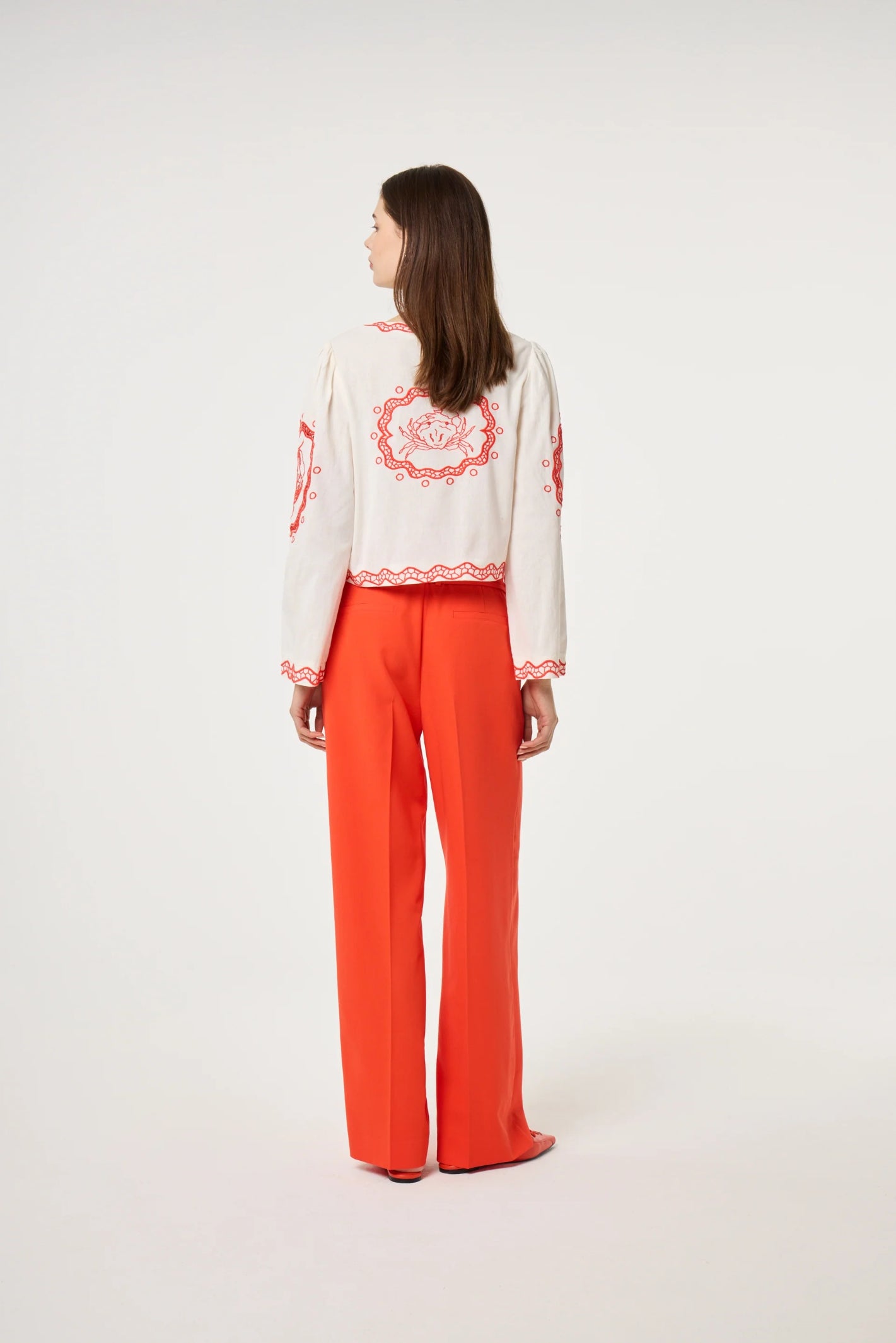 Model wearing Fabienne Chapot Serviette Blouse Cosy White/Tangerine Tango from Fabienne Chapot, shop at Dotique.