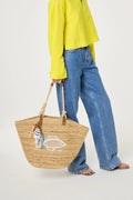Side view of model holding Fabienne Chapot Nico At Sea Bag Sand by Fabienne Chapot Shop the Fabienne Chapot at Dotique