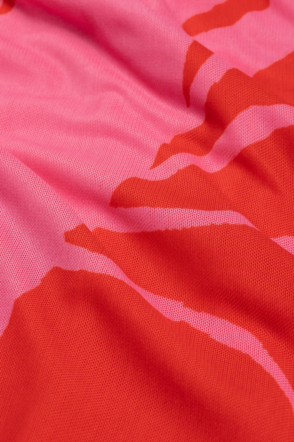 Close-up of red and pink fabric pattern of Fabienne Chapot Sionara Dress Red/Pink, shop Fabienne Chapot at Dotique