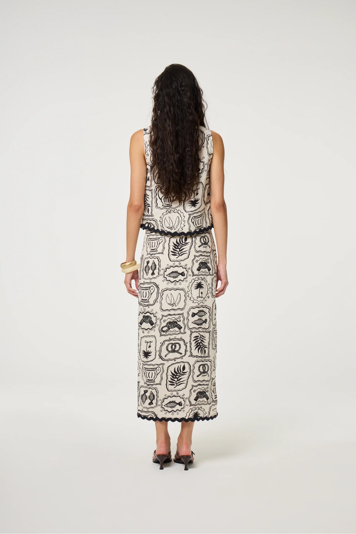 Back view of model wearing Fabienne Chapot Tila Skirt Cosy White/Black by Fabienne Chapot, shop Fabienne Chapot at Dotique