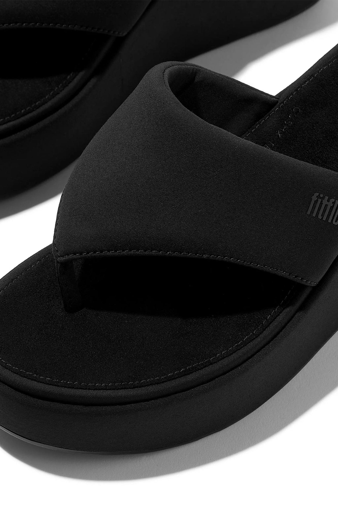 Close-up of Fitflop Platfforms Wedge Toe-Post Sandals All Black by Fitflop, shop Fitflop at Dotique.