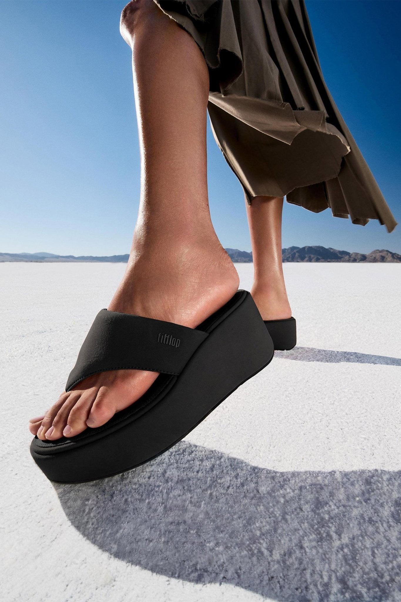 Fitflop Platfforms Wedge Toe-Post Sandals All Black by Fitflop shown outdoors, shop Fitflop at Dotique.