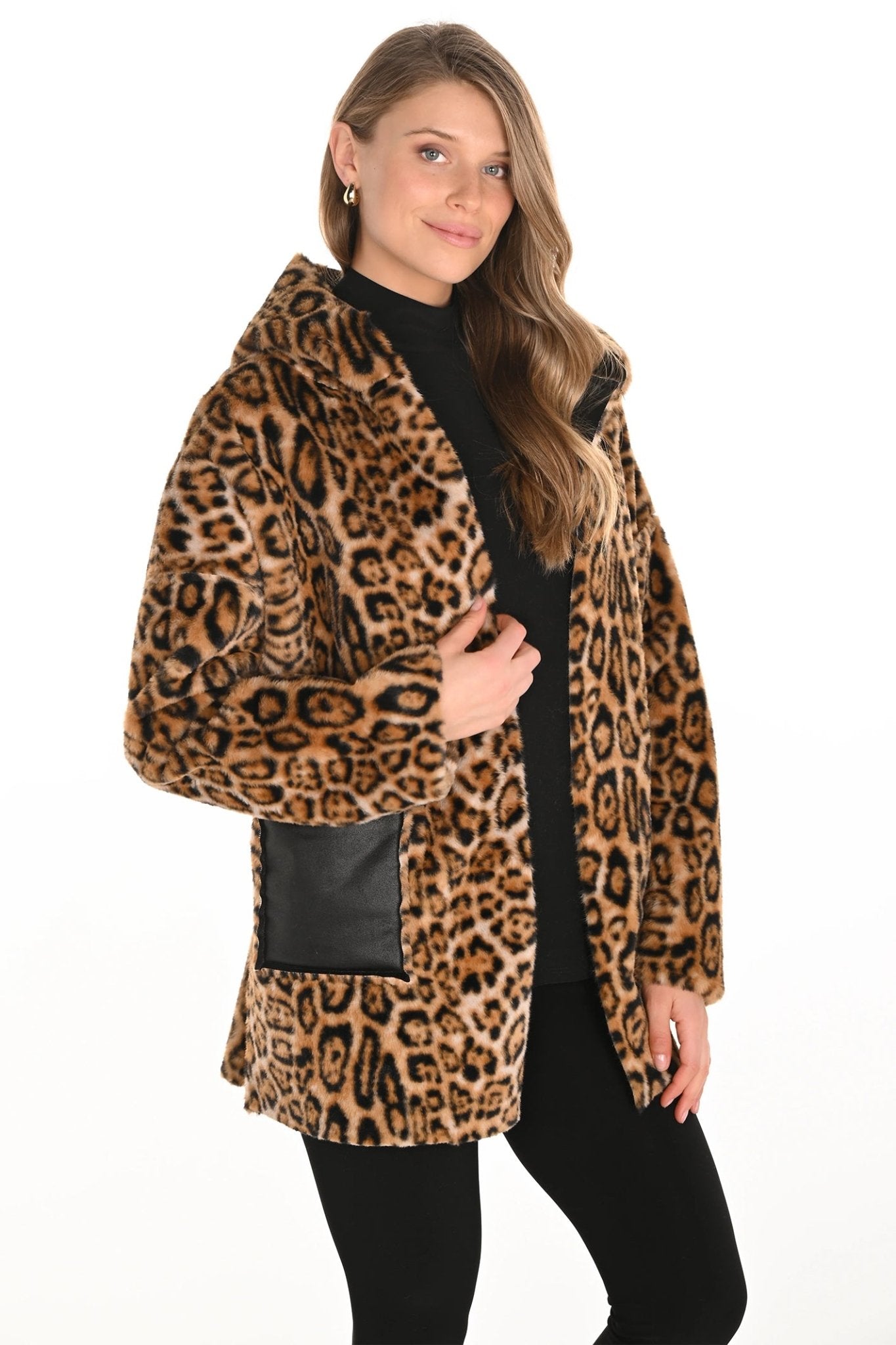 Woman wearing a leopard print coat with a black patch on a white background