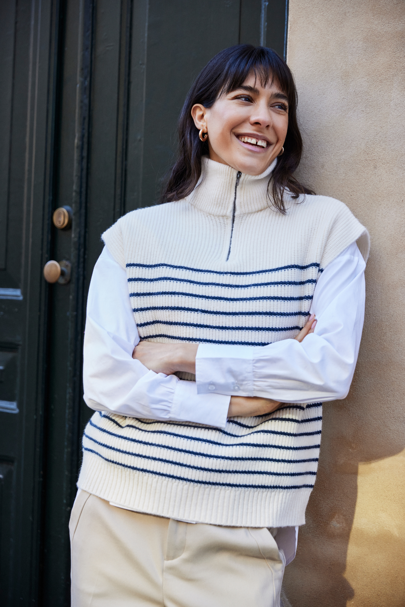  Fransa FRVINNA knitted tank top in Stripe Navy Blazer blends classic stripes with a modern twist thanks to its stylish front zip neckline. Shop Fransa at Dotique.