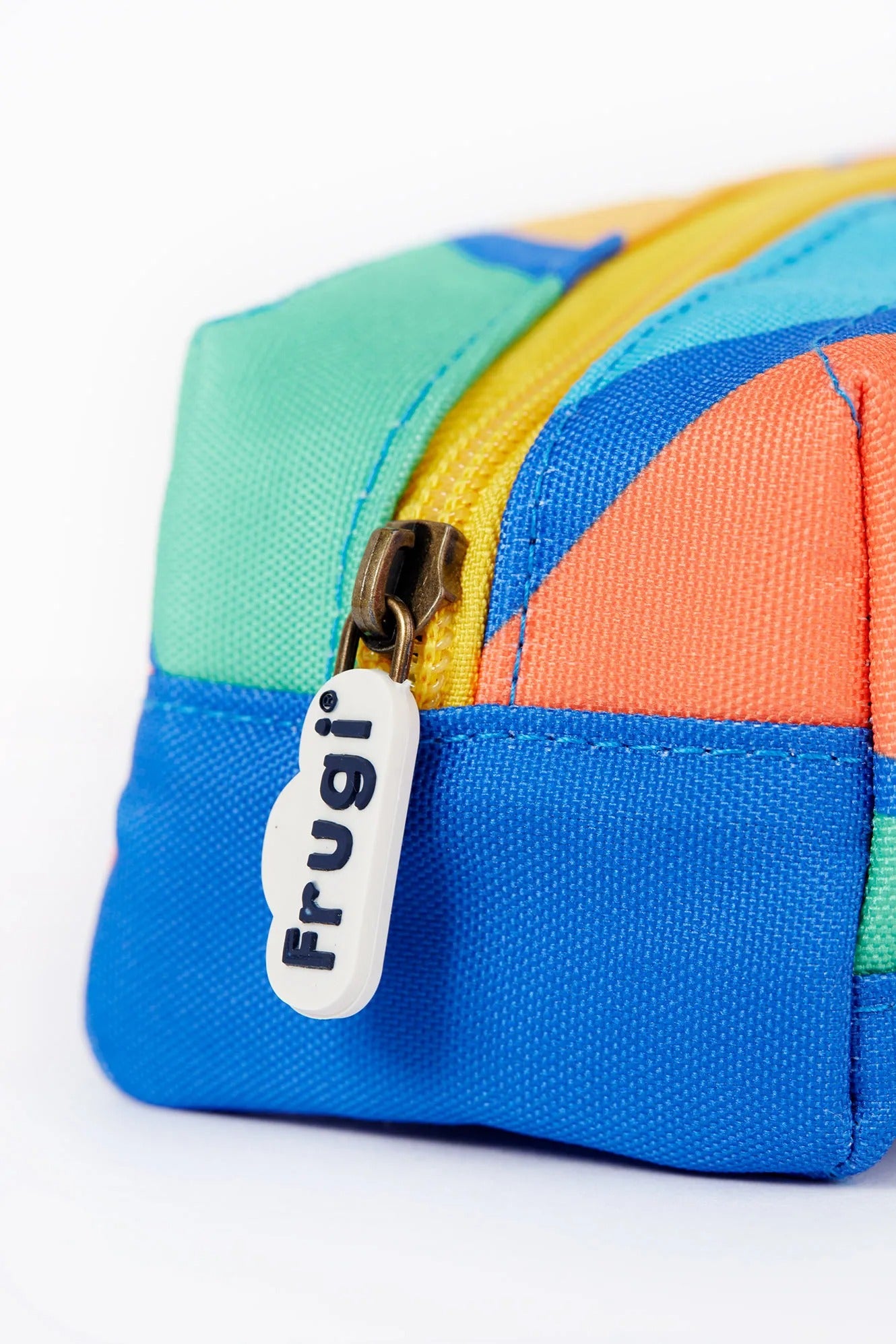 Colorful pouch with a zipper and 'Frugi' label on a white background