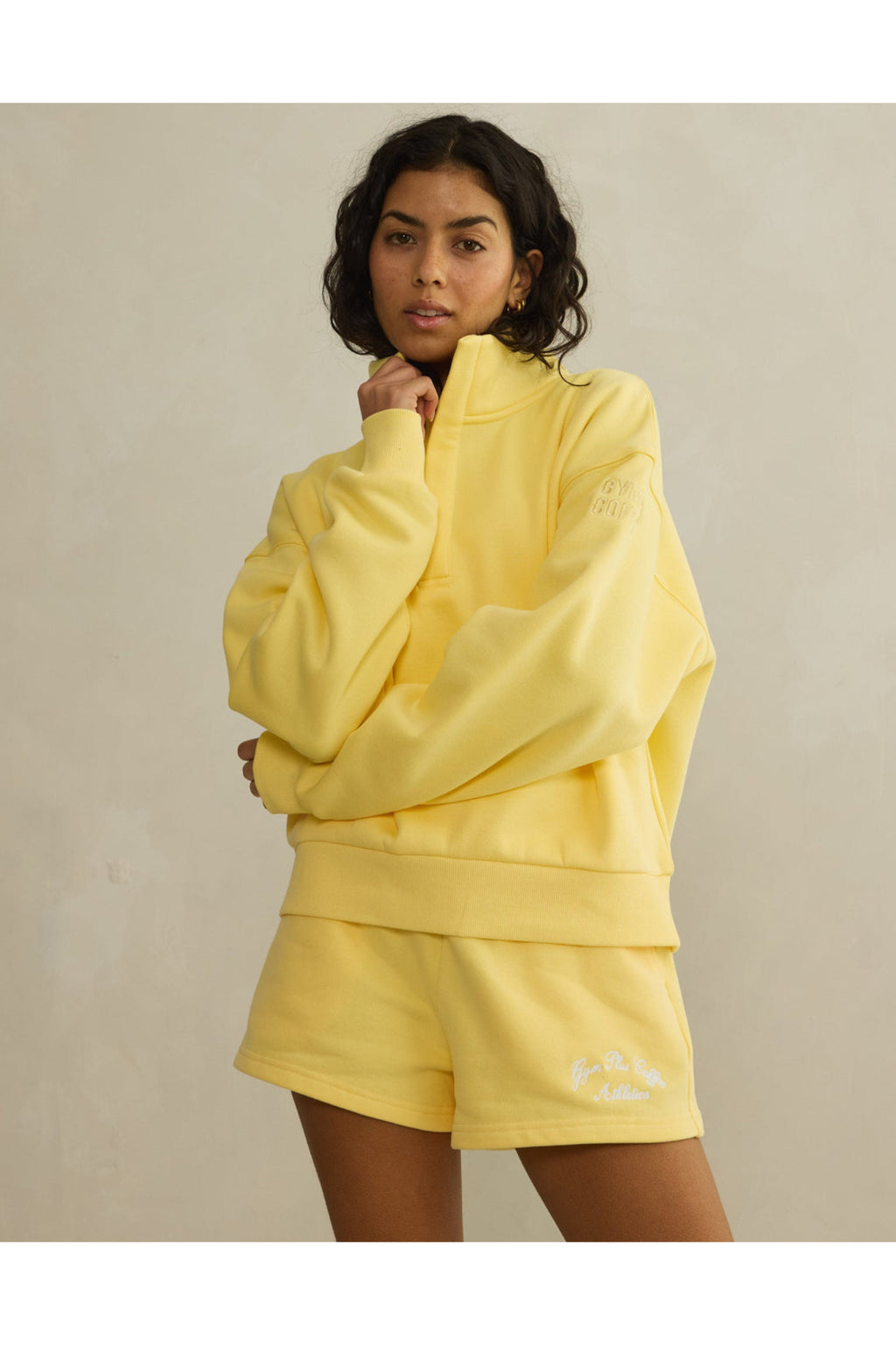 Model wearing Gym+Coffee Daily Cotton Shorts in Lemon Sorbet with matching top, shop Gym+Coffee at Dotique for relaxed style