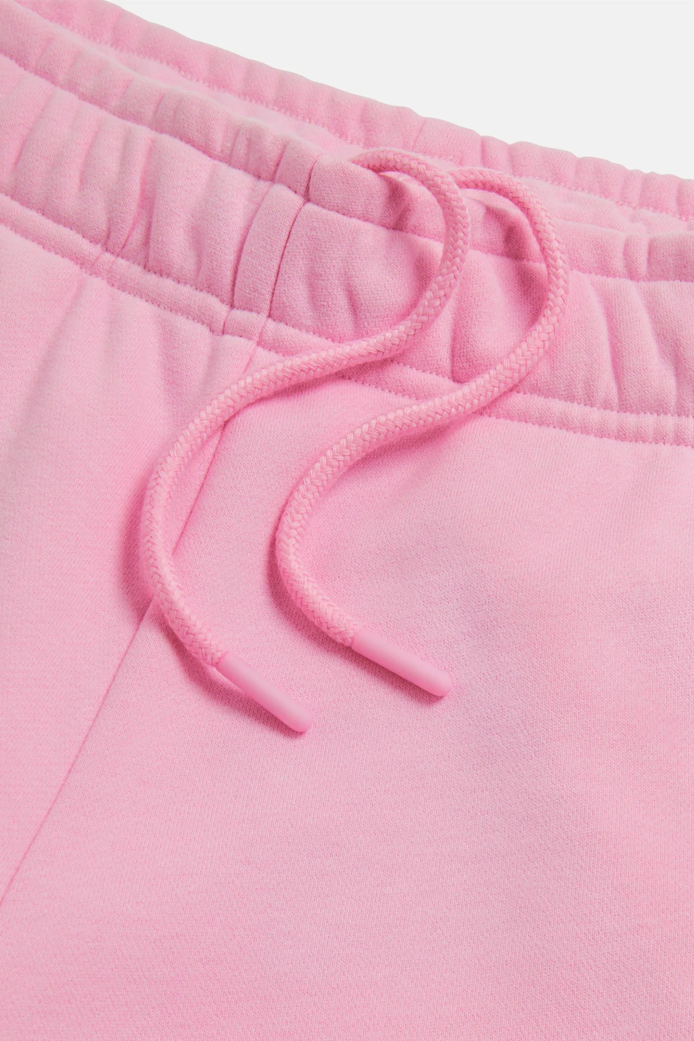 Close-up of drawstring and waistband on Gym+Coffee Daily Cotton Shorts in Pink Blossom by gym+coffee shop at Dotique