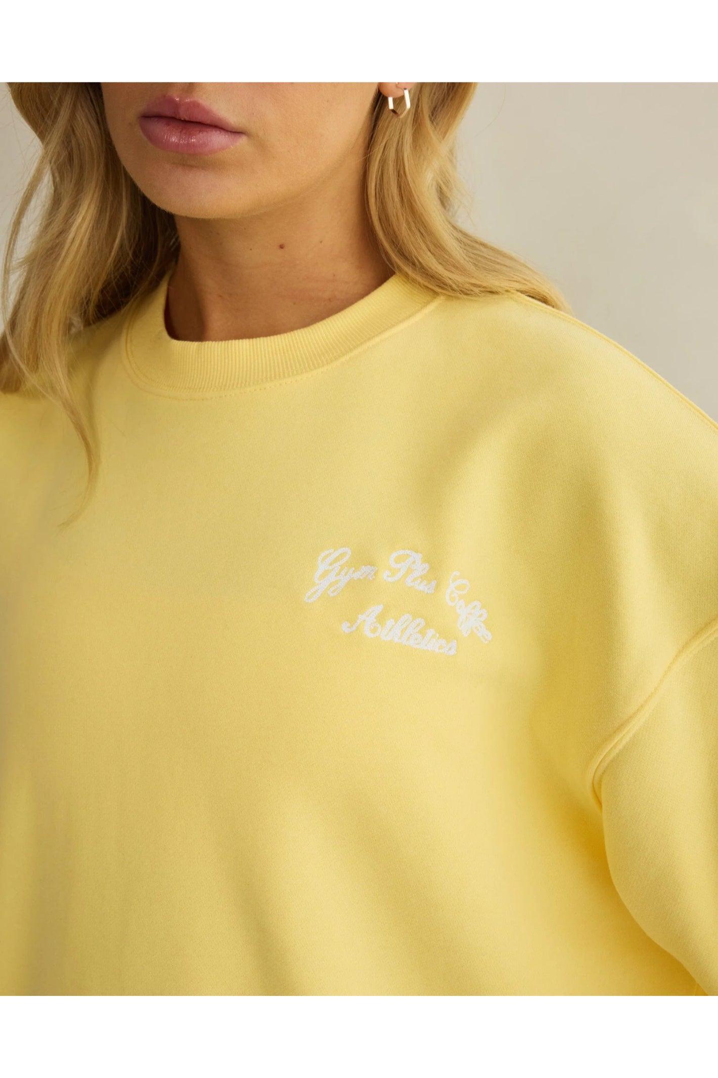Close-up of soft lightweight knit detail on Gym+Coffee Urban Crewneck in Lemon Sorbet, shop Gym+Coffee at Dotique for casual activewear