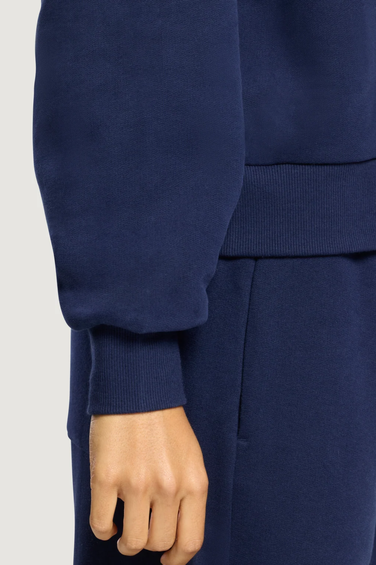 Gym+Coffee Daily Crewneck Twilight Navy by Gym+Coffee showing a navy sweatshirt sleeve and cuff. Shop Gym+Coffee at Dotique