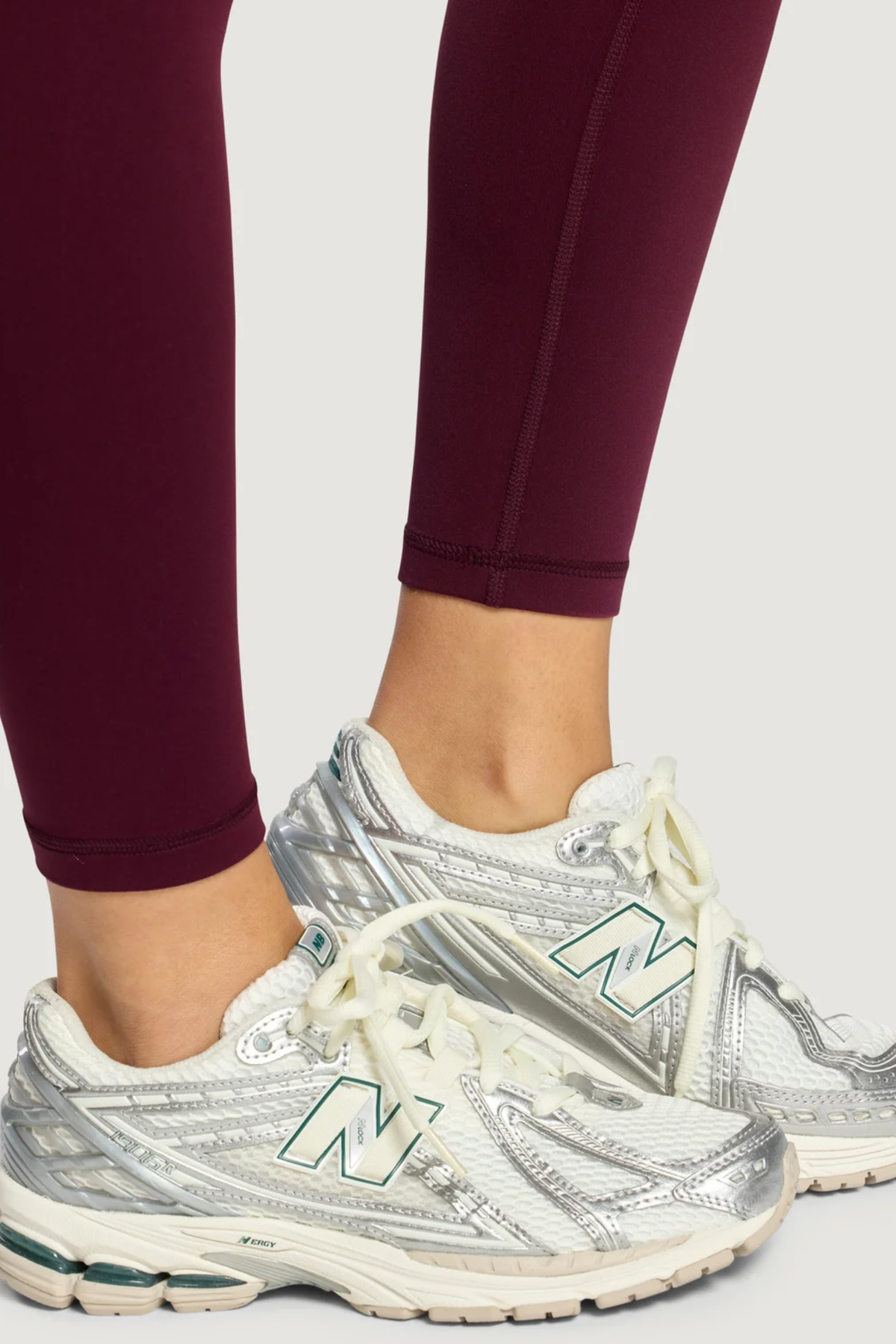 Gym+Coffee Daily Kind 7/8 Leggings Cherry Crush worn with sneakers. Shop Gym+Coffee at Dotique.
