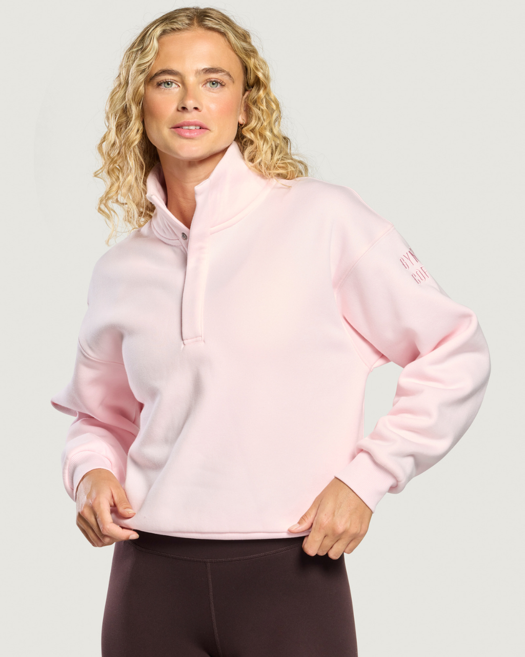 Gym+Coffee Daily Snap Collar Sierra Sweatshirt Ballet Pink worn by model. Shop Gym+Coffee at Dotique.