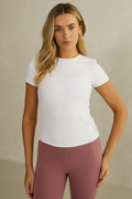 Woman wearing Gym+Coffee Daily Urban Tee in Ultra White by Gym+Coffee, shop Gym+Coffee at Dotique for stylish activewear.