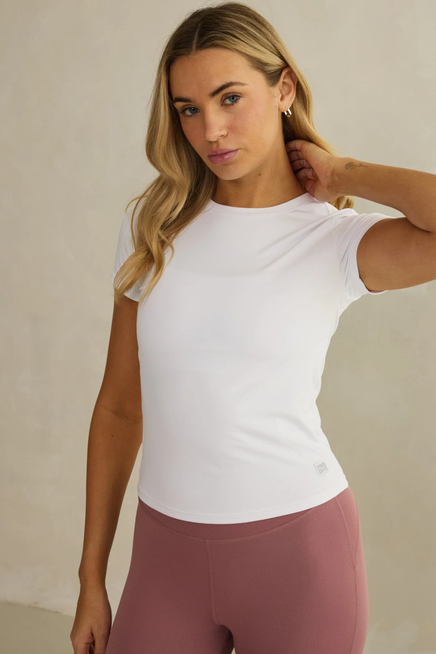 Model wearing Gym+Coffee Daily Urban Tee in Ultra White by Gym+Coffee, available to shop at Dotique.