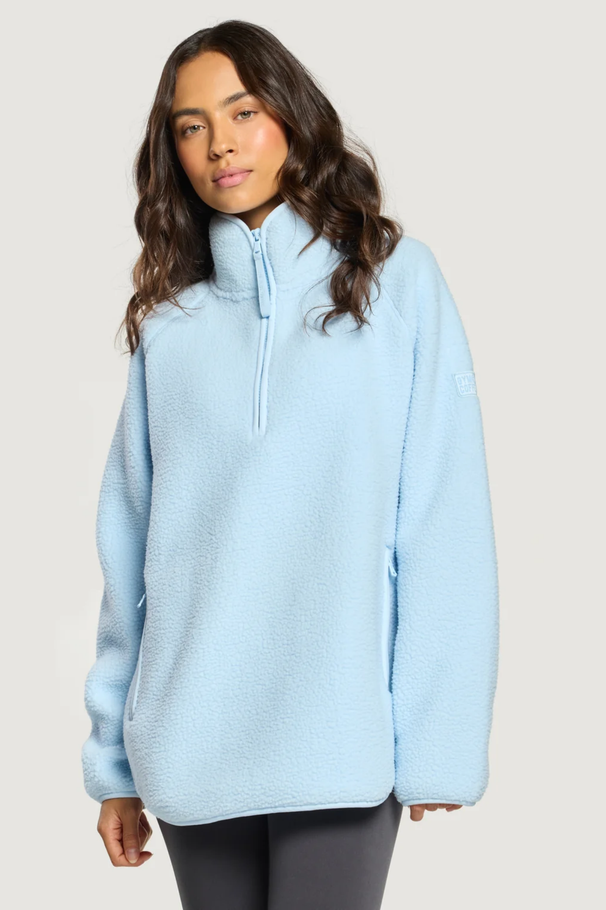 Gym+Coffee Horizon Longline Half Zip Glacial Blue fleece pullover on model. Shop Gym+Coffee at Dotique.