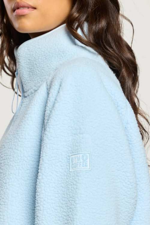 Gym+Coffee Horizon Longline Half Zip Glacial Blue by Gym+Coffee, light blue fleece. Shop Gym+Coffee at Dotique.