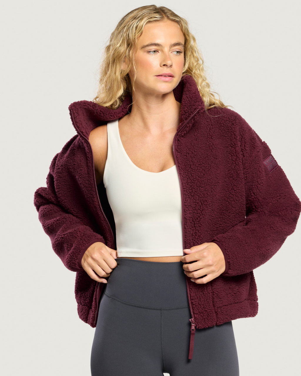 Gym+Coffee Industry Fleece High Collar Jacket Cherry Crush worn by a model Shop Gym+Coffee at Dotique