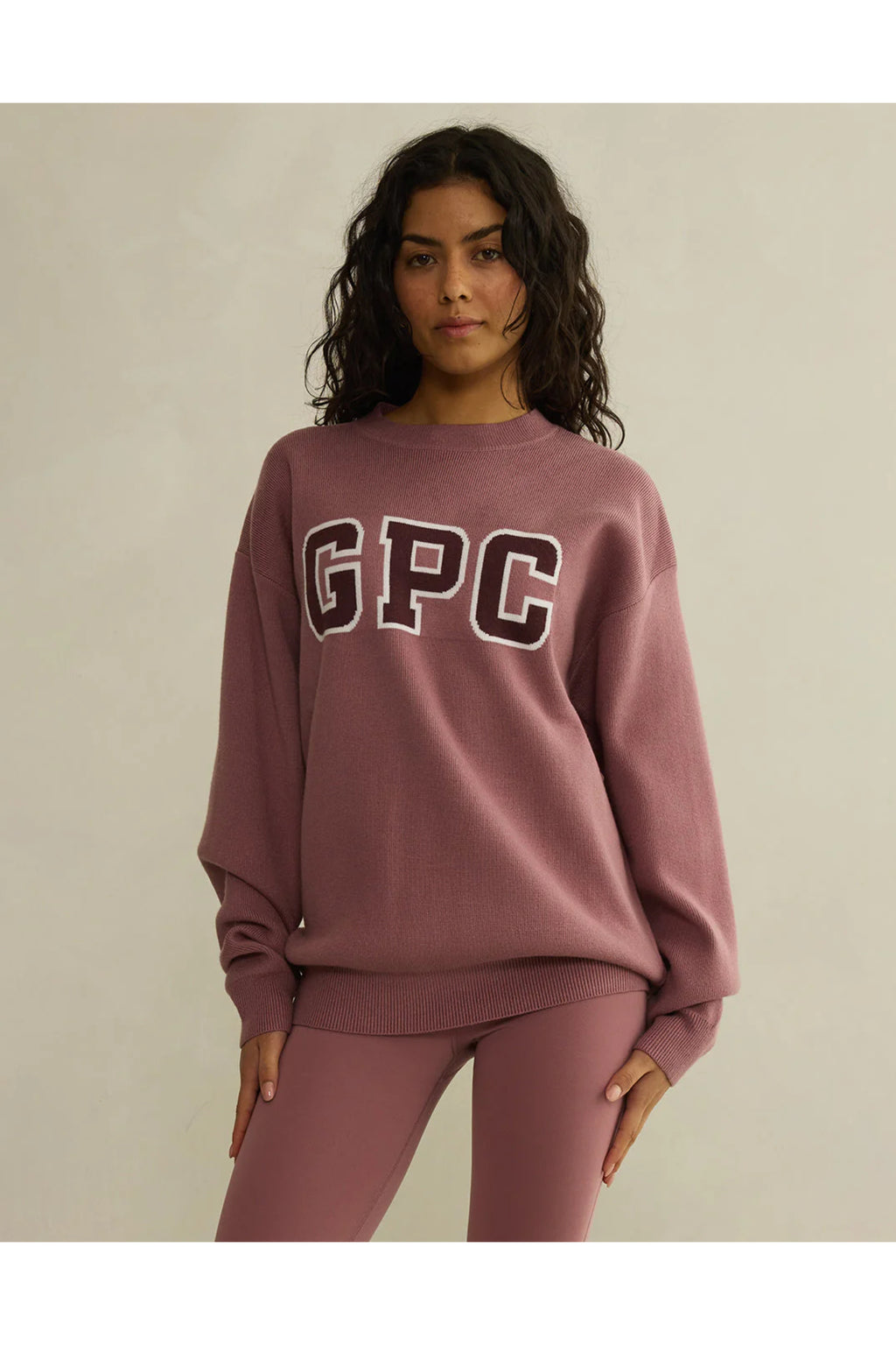 Gym+Coffee Knit Crew in Terra Rose worn by model featuring GPC logo, shop Gym+Coffee at Dotique for breathable activewear